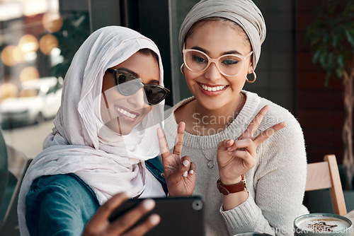 Image of Selfie, muslim women and friends with peace sign in city for social media, influencer content creation or fashion blog. Happy gen z people in Saudi Arabia, emoji profile picture or online photography