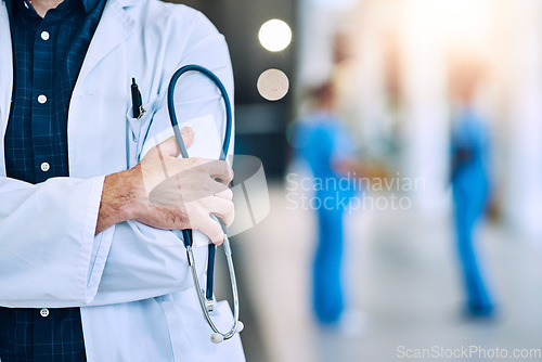 Image of Medical, crossed arms and closeup of a doctor with a stethoscope in a hospital with mockup space. Career, professional and zoom of a male healthcare worker hand with equipment in a medicare clinic.