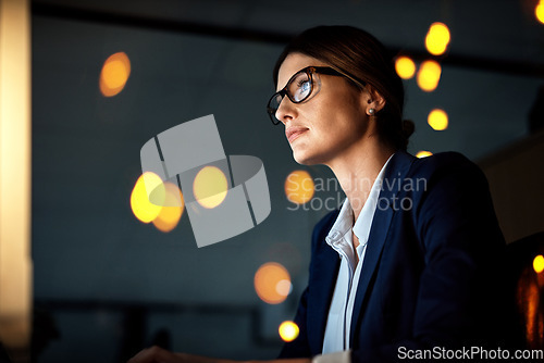 Image of Night, computer or businesswoman reading research or networking overtime on digital marketing strategy. Late, startup or focused employee online for project email deadline on internet at office desk