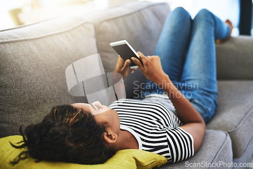 Image of Relax, phone and woman laying on sofa in home for network, online website and social media. Communication, mobile app and happy female person on smartphone for chatting, text message and internet