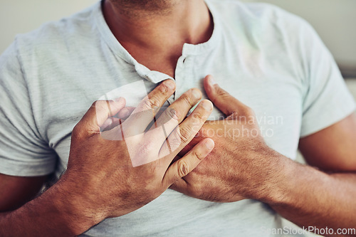 Image of Healthcare, heart attack and man with chest pain, sickness or cardiovascular disease at his home. Medical emergency, ill and closeup of a male person in cardiac arrest or inflammation at his house.