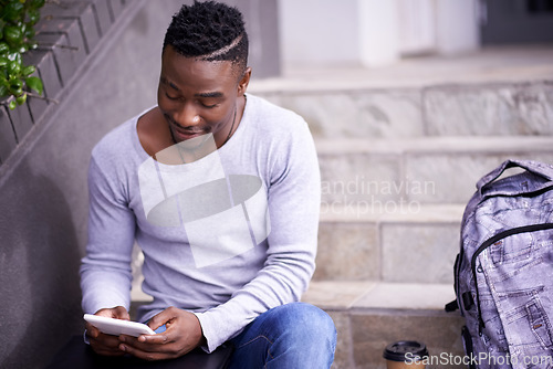 Image of Relax, college and tablet with black man on stairs for learning, education or research. School, social media and technology with male student on steps of university campus for app, digital or study