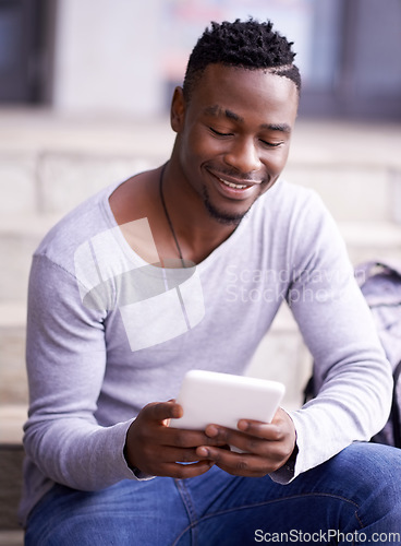 Image of Happy, college and tablet with student on stairs for learning, education or research. Smile, social media and technology with male black man on steps of university campus for app, digital or study