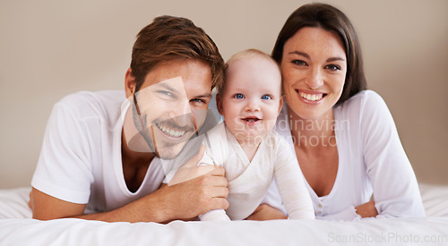 Image of Happy portrait, dad and mom of baby kid on bed for love, care and quality time together to relax at home. Smile of family, parents and cute newborn child for development, caring support and happiness