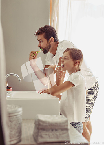 Image of Brushing teeth, father and child in a bathroom at home in morning with dental cleaning. Oral hygiene, kids and dad together in a house with bonding and parent love for children with toothbrush