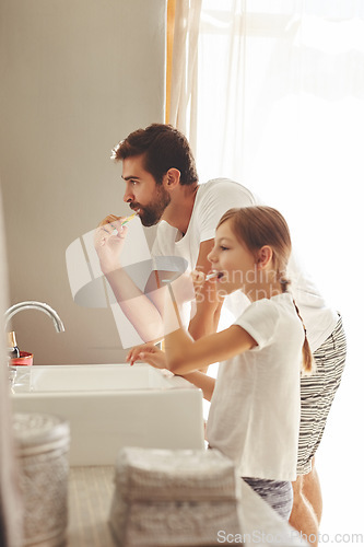 Image of Brushing teeth, dad and young child in a bathroom at home in morning with dental cleaning. Oral hygiene, kids and father together in a house with bonding and parent love for children with toothbrush