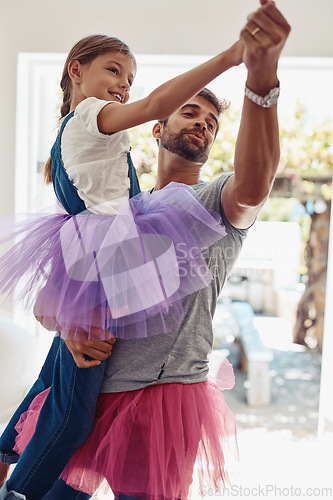 Image of Father with daughter dancing in tutu, playful and fun at home with bonding with love and care Family, man and girl dance in living room, carefree and spending time together with relationship and joy