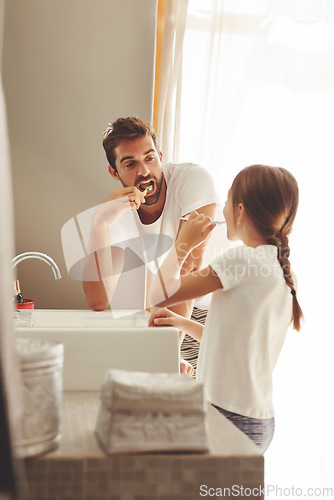 Image of Brushing teeth, father and child learn in a bathroom at home in morning with dental cleaning. Oral hygiene, kids and dad together in a house with bonding and parent love for children with toothbrush