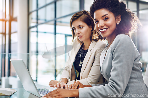 Image of Business, businesswomen with laptop and at desk in modern office at work. Communication or conversation, portrait of friends or women colleagues and coworkers discussing or speaking in workplace