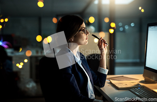 Image of Night, computer or business woman reading research or networking overtime on digital marketing strategy. Late, lens flare or focused employee online for project email deadline on internet in office