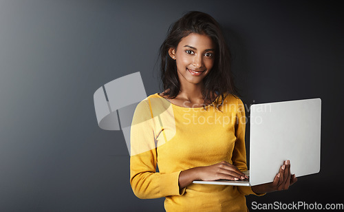 Image of Woman, student and portrait with a laptop for university and school work with mockup. Isolated, gray background and education work of a young Indian female person with smile and computer for college