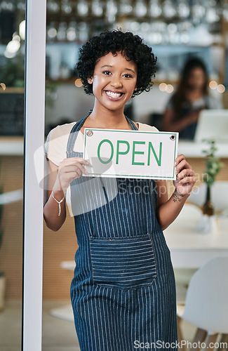 Image of Happy woman, open sign and portrait of small business owner or waitress at cafe for morning or ready to serve. African female person at restaurant holding board for coffee shop or cafeteria opening