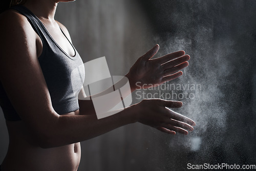 Image of Fitness, woman and dust hands with chalk for intense workout, training or exercise at the gym. Hand of female personal trainer with powder for weightlifting, grip or preparation for exercising