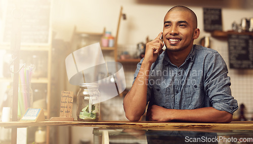 Image of Smile, phone call and man with startup success, connection and communication for planning. Male person, happy employee and business owner with happiness, conversation and discussion in store and shop
