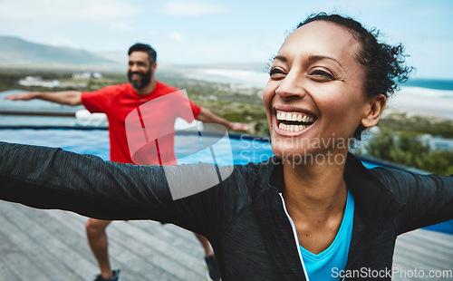 Image of Fitness, wellness and couple doing outdoor yoga stretching together on a rooftop of a building. Happy, smile and young man and woman doing a pilates warm up exercise or workout for health in nature.