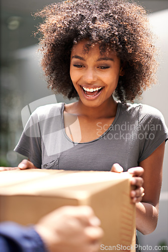 Image of Happy customer, delivery and giving cardboard box while excited for courier service. African woman outdoor to collect a package from shipping, cargo or logistics worker with a smile at home