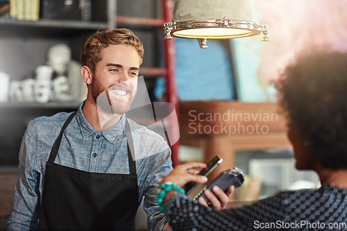 Image of Man, barista and client with smartphone payment, cafe and transaction for services, smile and fintech. Female customer, male employee and happy guy at a coffee shop, small business and financial