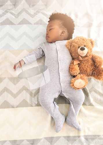 Image of Top view, bed and baby sleeping with teddy bear for rest, nap time and dreaming in nursery. Childcare, newborn and cute, tired and African child in bedroom sleep for comfort, relax and calm at home