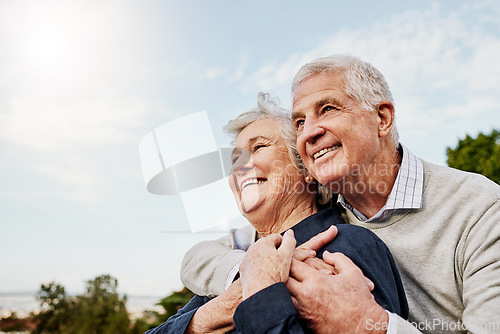 Image of Sky, elderly couple and hug outdoors or happy in retirement or husband and wife in nature. Mature, man and woman smile in vacation or senior citizens care and embrace or date at the park for romance