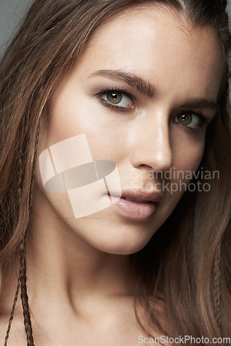 Image of Face, beauty and portrait of beautiful woman in studio for wellness, facial treatment and skincare. Salon, closeup and female person with natural cosmetics, makeup and skin glow on gray background