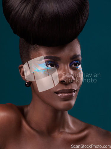 Image of Idea, hair and makeup with a model black woman in studio on a blue background for beauty. Thinking, haircare and cosmetics with an attractive young female person at the salon for fashion or styling