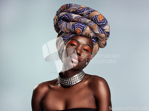 Image of Black woman in African turban, portrait with fashion and beauty, makeup isolated on studio background. Natural cosmetics, glow and female model with traditional head wrap, mockup space and style