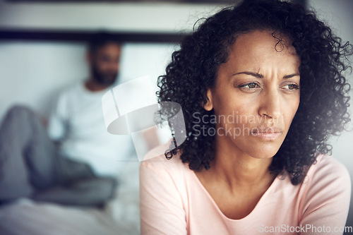 Image of Divorce, angry black woman and couple in bedroom of their home or house. Marriage or relationship, communication or conflict and frustrated African female with breakup or couple problems inside