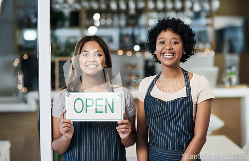 Image of Happy woman, open sign and portrait of cafe team in small business or waitress for morning or ready to serve. Women or restaurant servers holding board for coffee shop, store or cafeteria opening