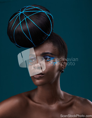 Image of Idea, hair care and makeup with a model black woman in studio on a blue background for beauty. Thinking, fashion and cosmetics with an attractive young female person at the salon for a hairstyle