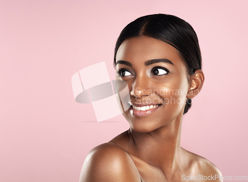 Image of Thinking, skincare and face smile of woman in studio isolated on a pink background mockup. Natural beauty, happy and Indian female model with makeup, cosmetics or spa facial treatment for skin health