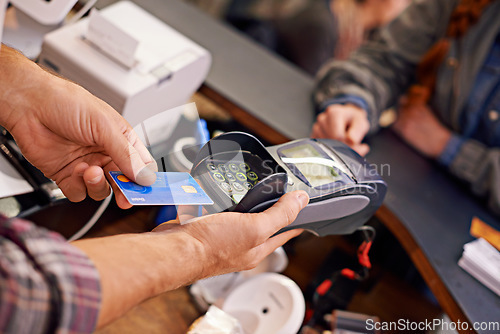 Image of Credit card, shopping and customer at a cafe or cashier hands or debit machine and over the counter sale. Payment, device view and cashless method for bills or store keeper in commercial place or pos