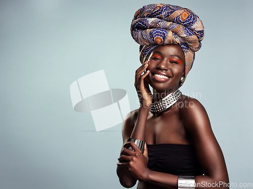 Image of Smile, black woman and portrait with African head wrap and beauty in a studio. Isolated, grey background traditional Africa turban with a young face and female model with culture pride and mockup