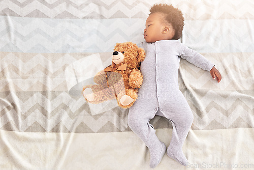 Image of Top view, teddy bear and baby sleeping in bedroom for rest, nap time and dreaming in nursery. Childcare, newborn and cute, tired and African child with toy in bed for comfort, relax and calm at home