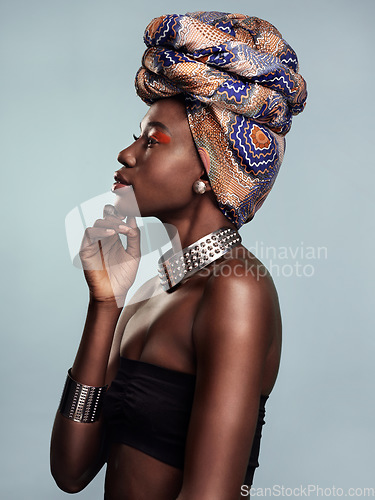 Image of Fashion, head scarf and profile of black woman in studio on gray background with glamour, cosmetics and makeup. Luxury, culture and face of female person in exotic jewelry, African style and beauty