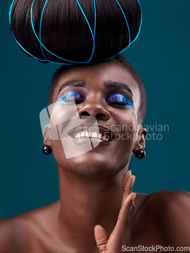 Image of Happy, hair and cosmetics with a model black woman in studio on a blue background for beauty. smile, haircare and makeup with an attractive young female person at the salon for fashion or styling
