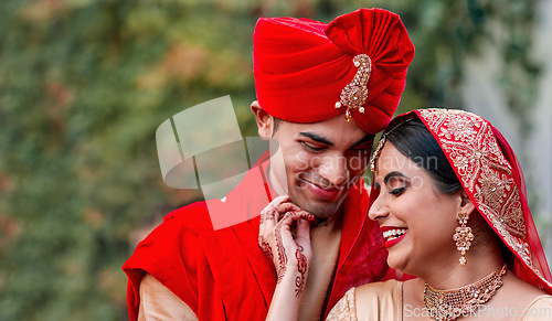 Image of Wedding, marriage and indian couple together in celebration of love or commitment at a ceremony. Happy, romantic or hindu with a bride and groom getting married outdoor in tradition of their culture