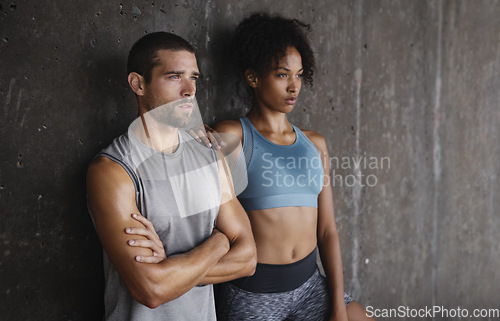 Image of Fitness, serious and man and woman in city for cardio workout, body builder training and exercise. Sports, thinking and couple sweat from running for endurance, wellness and vision on wall background