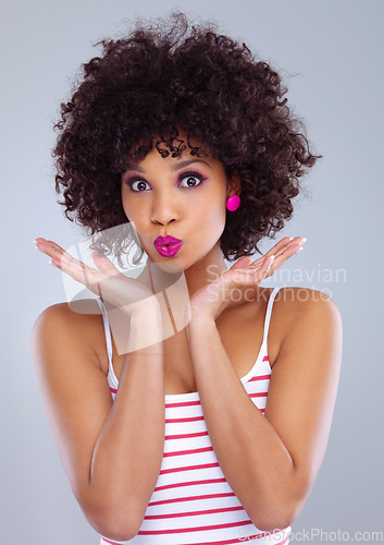 Image of Face, beauty and portrait of black woman in studio on gray background for makeup, skincare or cosmetics. Young female, model pouting and pink lipstick or eyeshadow and natural hair confidence
