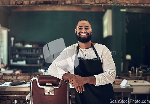 Image of Barber shop, hair stylist and black man portrait of an entrepreneur with a smile. Salon, professional worker and male person face with happiness and proud from small business and beauty parlor