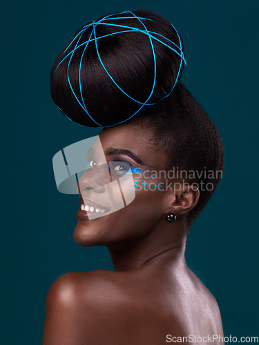 Image of Thinking, happy and hair with a model black woman in studio on a blue background for beauty. Idea, smile and makeup with an attractive young female person at the salon for trendy fashion or cosmetics