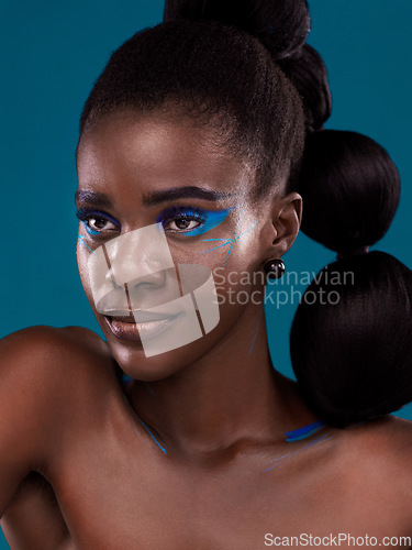 Image of Thinking, makeup and hair care with an african woman in studio on a blue background for hairstyle or cosmetics. Face, idea and fashion with an attractive young female model posing for beauty or style