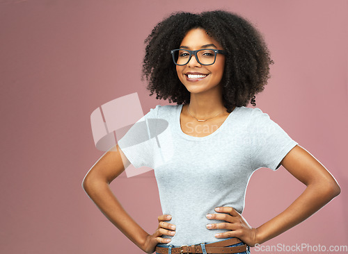 Image of Portrait, smile and black woman with glasses akimbo in studio isolated on a pink background. Natural beauty, nerd and African female model from Nigeria with confidence, cosmetics and face mockup.
