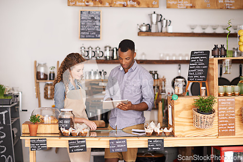 Image of Small business owners, tablet and teamwork of people, manage orders and discussion in store. Waiters, black man and happy woman in cafe with technology for inventory, stock check and managing sales.