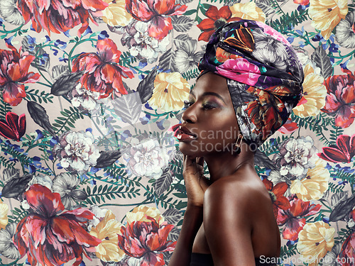 Image of Black woman in turban, fashion on flower background and beauty, makeup with floral aesthetic. Natural cosmetics, profile and female model in traditional African head wrap with creativity and style