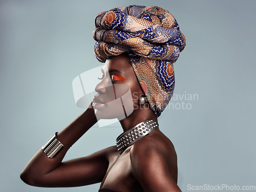 Image of Black woman in African turban, fashion and beauty with makeup isolated on studio background. Natural cosmetics, face profile and female model with traditional head wrap, mockup space and style