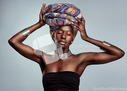 Image of African fashion, makeup and black woman in studio on white background with luxury, cosmetics and beauty. Glamour, luxury and face of female person glow in exotic jewelry, traditional style and scarf