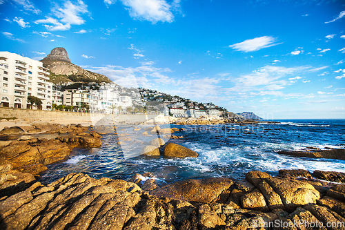 Image of City, travel and view of rocky ocean for natural environment, ecosystem and seascape background. Traveling mockup, location and sea in South Africa for holiday, summer vacation and global destination