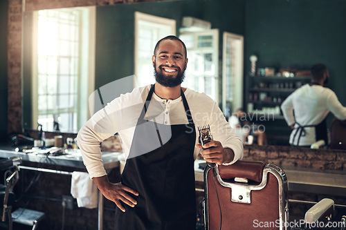 Image of Barber shop, hair clipper and black man portrait of an entrepreneur with a smile. Salon, professional worker and male person face with happiness and proud from small business and beauty parlor