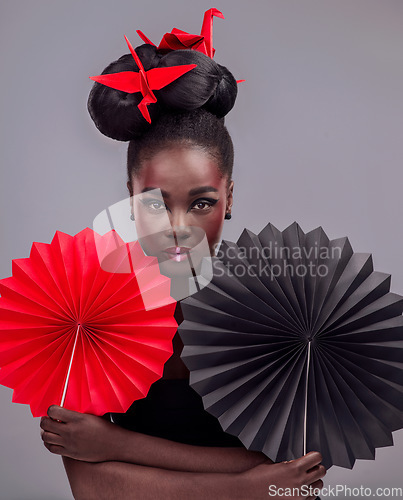 Image of Portrait, makeup and origami with black woman in studio for creative, art and culture. Traditional, cosmetics and paper design with female model on grey background for asian, beauty and color