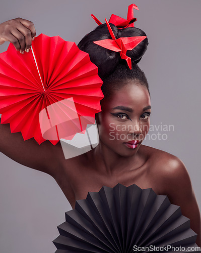 Image of Creative beauty, portrait and makeup with black woman in studio for art and culture. Fashion, cosmetics and paper design with female model on grey background for asian, origami or color